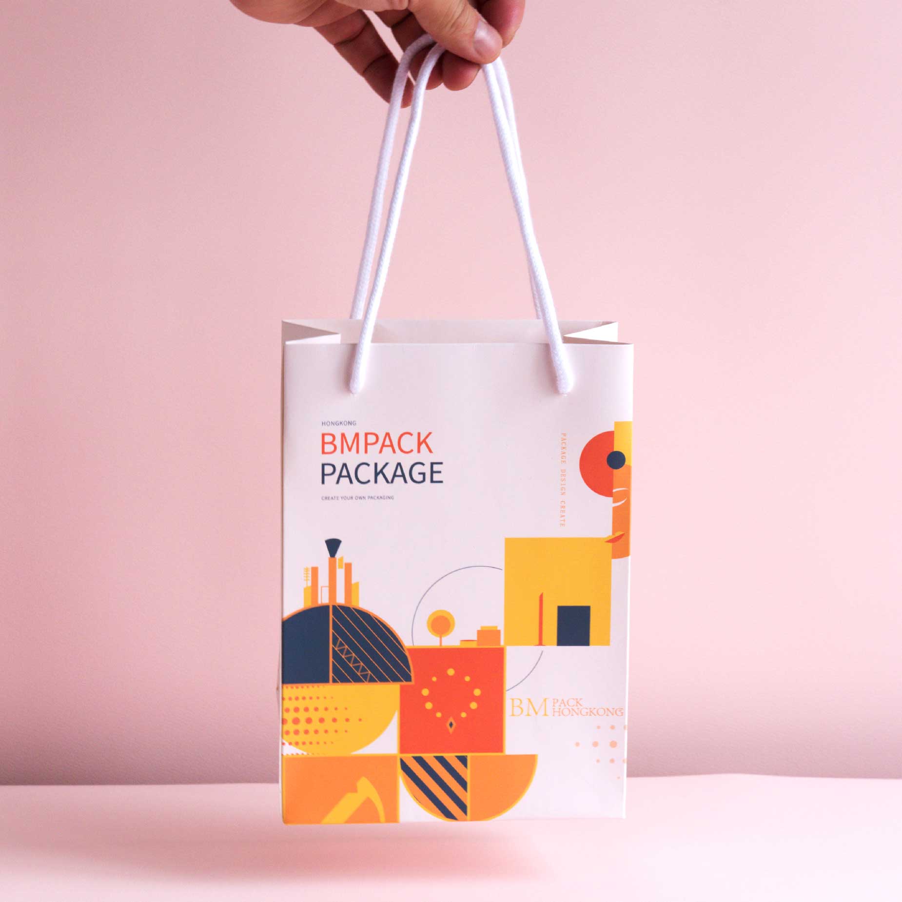 Rope handle paper bag side view, being held - BM Pack custom packaging Hong Kong